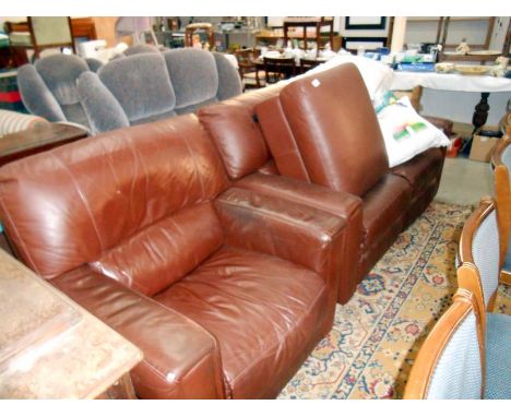 A brown leather sofa, chair and pouffe