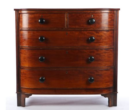 Victorian mahogany bow front chest of two short and three long drawers, with turned bun handles, raised on bracket feet, 105c