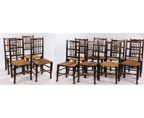 Matched set of twelve ladder back dining chairs, 19th Century, with ladder backs above rush sets and turned legs, (12)