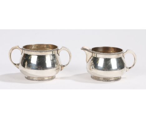 George V silver milk jug and twin handled sugar bowl, Sheffield 1923, makers Mappin &amp; Webb, with gadrooned borders and fe