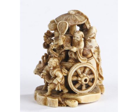 Japanese Meiji period ivory netsuke, depicting a canopied cart pulled by a stag, the cart containing various figures holding 