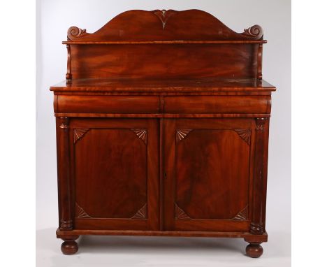 Victorian mahogany chiffonier, the scrolled upstand with shelf, raised on scrolled supports, with two bow front concealed fri