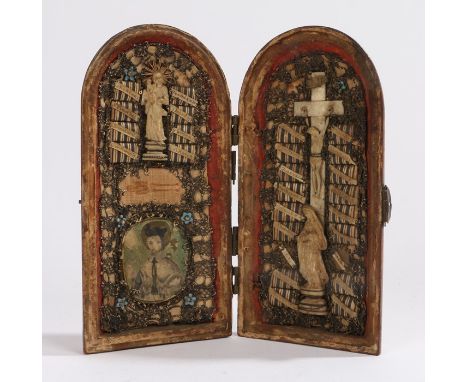 19th Century icon, the mahogany hinged case opening to reveal carved figures, Christ on the Cross, a portrait and text, 15cm 