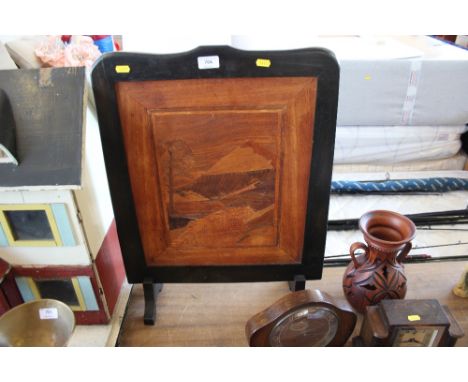 A wooden fire screen 