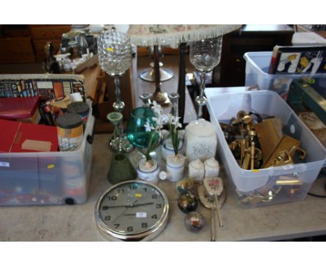 A Cabanaz wall clock; storage jars; candle holders; green glass vase; three small globe ornaments; dressing table items etc 