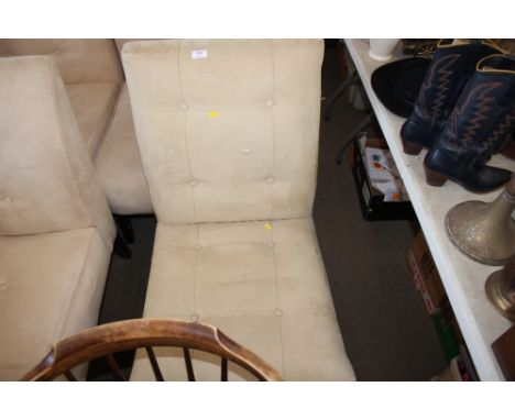 A button down upholstered bedroom chair 