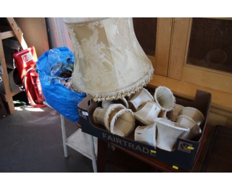 A box and a bag containing light shades AF together with various materials and a rug 