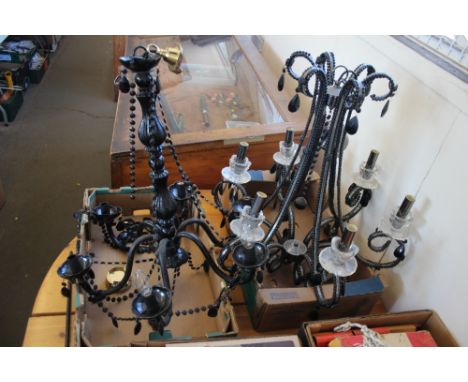 A six branch chandelier together with one other six branch chandelier  