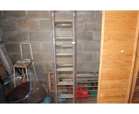 An extending wooden ladder