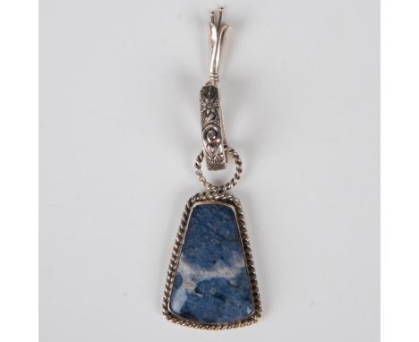 This unique pyramid shaped stone appears to be denim sodalite. The color looks like your favorite perfectly washed blue jeans