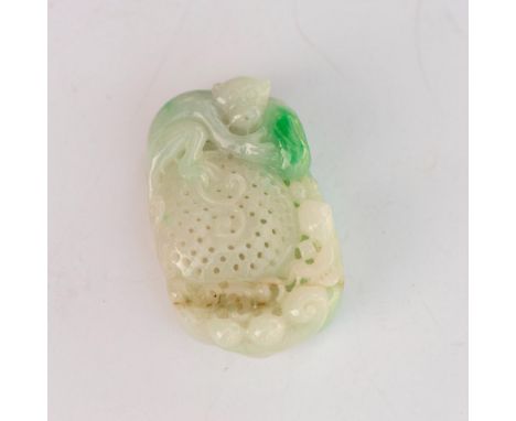 A beautiful and whimsical hand carved jade pendant of a monkey on top of a basket protectively holding a peach. Dimensions: 2