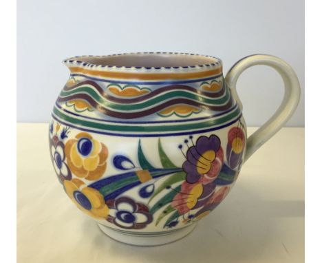 A large Poole Pottery jug 17cm tall.