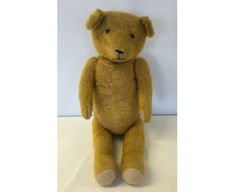 A vintage American fully jointed mohair stick teddy bear, straw filled with growler (not working), approx 20 inches tall.