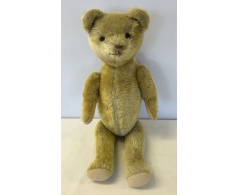 A vintage American fully jointed blonde mohair stick teddy bear, straw filled with bellows growler (not working). Approx 18 i