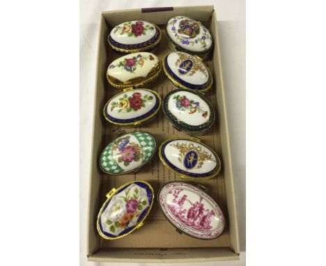 10 oval collectors trinket boxes with domed lids, in various designs.