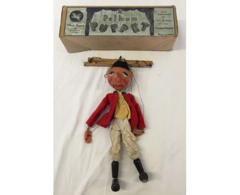 A rare c1950s Pelham puppet Huntsman in original box.