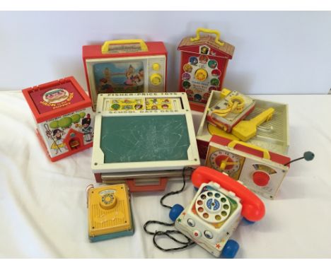 A collection of vintage Fisher Price toys.