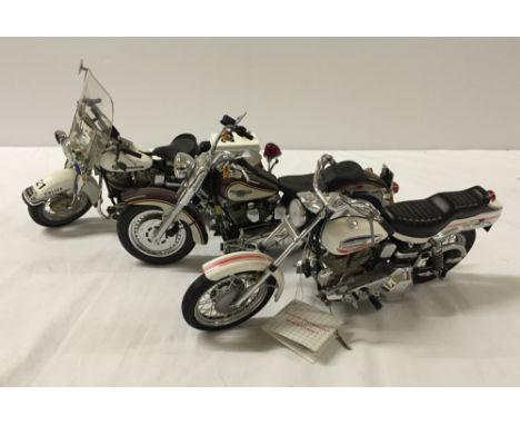 3 unboxed Franklin Mint 1:10 scale Harley Davidson motor cycles to include Police Motor Cycle.