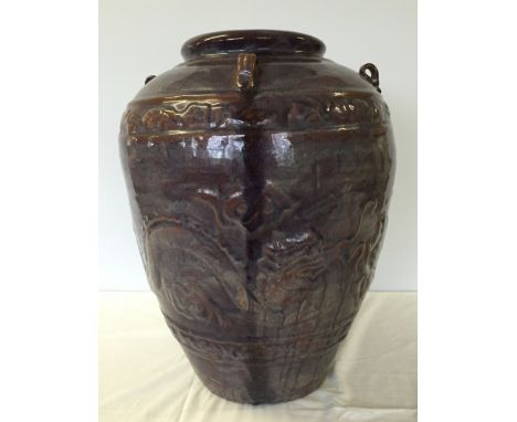 A large vintage oriental purple glazed ceramic planter. 48cm tall with raised dragon design.