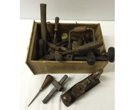 A box of vintage woodworking tools.