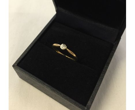 An 18K gold diamond solitaire ring. Size K½. Approx 1.9g.