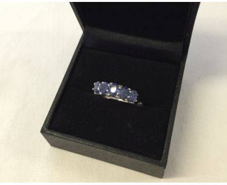 A blue sapphire & diamond silver ring size K (boxed).