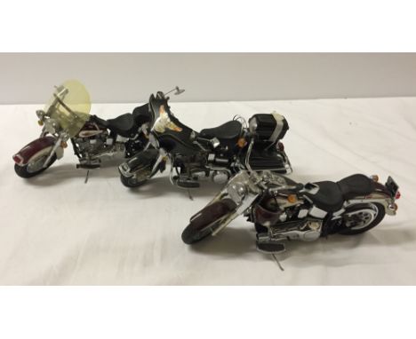 3 unboxed Franklin Mint 1:10 scale Harley Davidson motor cycles.