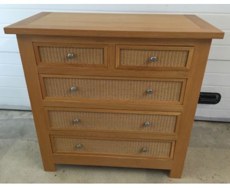 A light wood & woven 2 over 3 chest of drawers. 105cm wide x 102cm tall x 52cm deep.