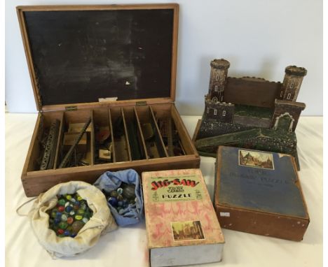 A vintage small wooden toy soldier fort/castle together with 2 Chad Valley Great Western Railway Poster wooden jigsaw puzzles