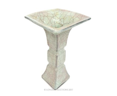 A Chinese ceramic vase of square form with a crackle glaze and a flared rim, 23 x 12.5 x 12.5cm.
