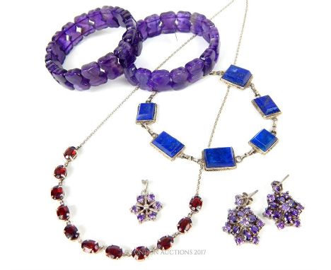 A collection of silver and gem-set jewellery to include a sterling silver and lapis lazuli six-panel bracelet, a silver neckl
