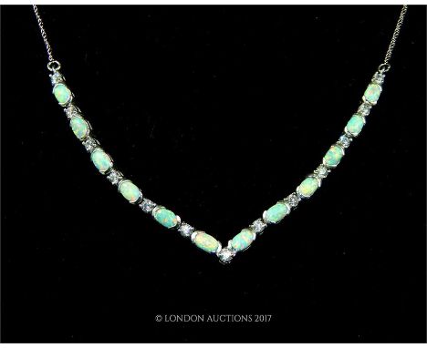 A opal and CZ necklace on a silver chain (stamped 925). 