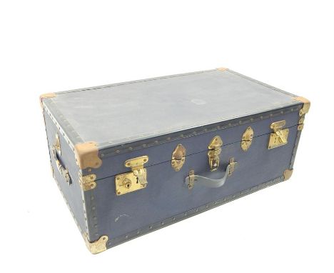 A mid 20th century blue travel trunk, with brass detail, 30 x 84 x 48cm.