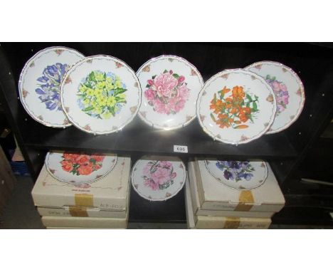 Eight boxed Royal Albert floral collector's plate.