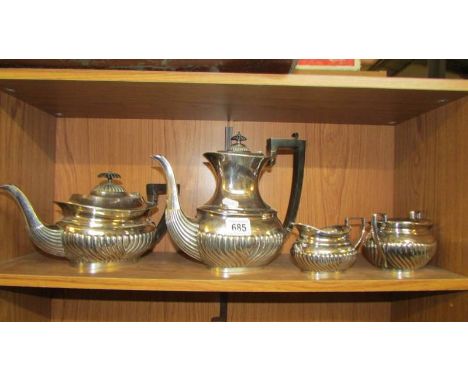 A four piece silver plate tea set.