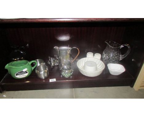 A mixed lot including vintage jelly moulds, china moulds, silver plate, brewery advertising jugs etc.,