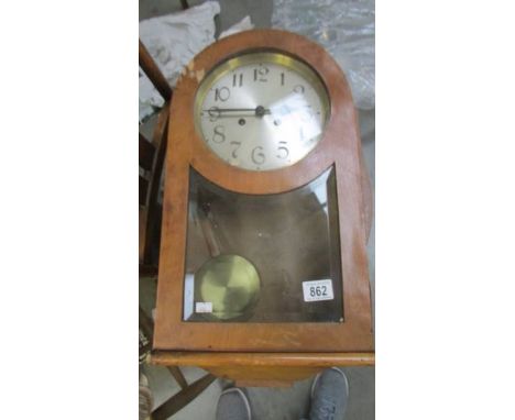 An old 8 day wall clock.  (Collect only)