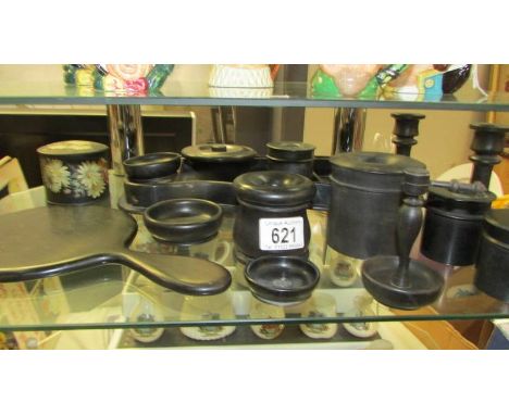 An Ebony dressing table set, some pieces having silver mounts, (mirror a/f) includes a bakelite pot etc.,