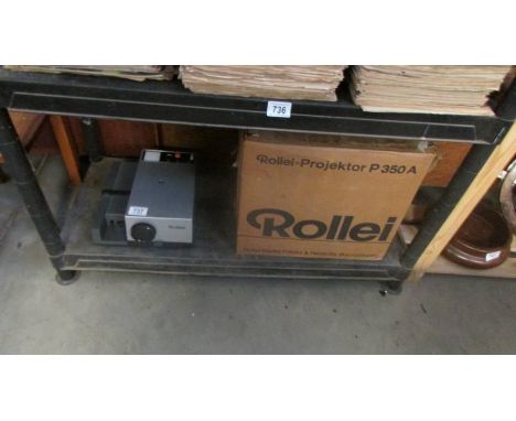 A boxed Rollei projector.