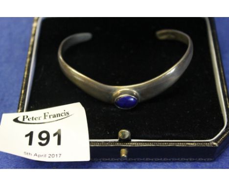 Sterling silver arrowhead design bangle set with blue stone.(B.P. 24% incl. VAT)