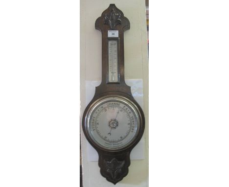 Early 20th Century oak wheel barometer with thermometer.(B.P. 24% incl. VAT)