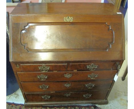 18th Century mahogany bureau with inlaid central cupboard door, over two short and three long drawers, on bracket feet.(B.P. 