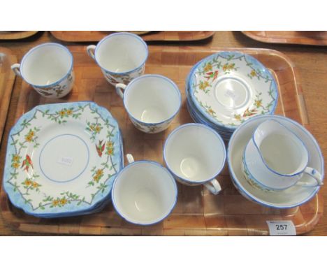 Tray of Melba bone china teaware on a white ground with painted, enamelled birds amongst foliage, comprising: teacups and sau