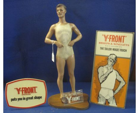 Small shop advertising mannequin for 'Y Front Briefs and Singlets' together with a printed card sign and a plastic sign. (3)(