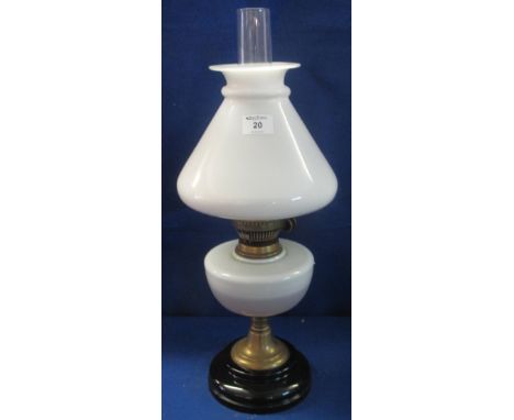 Brass double burner oil lamp with opaline glass reservoir on brass column, with ceramic base.  Opaline glass shade and clear 