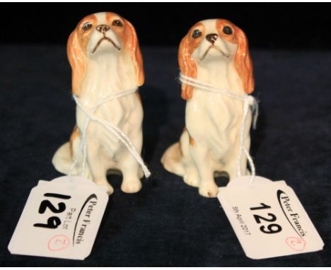 Pair of Beswick bone china studies of seated dogs, 'Charity Sale'. (2)(B.P. 24% incl. VAT)