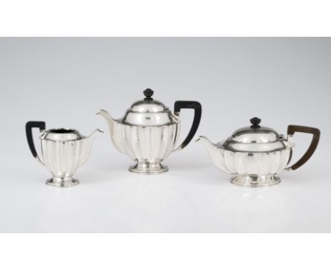 A silver tea and coffee serviceComprising: teapot, coffee pot and milk jugSilver, fineness .833Polished and fluted decoration