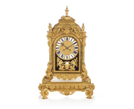 A Napoleon III mantel clockGilt, relief and chiseled bronzeArchitectural case decorated with foliage scrolls, ram's heads, li