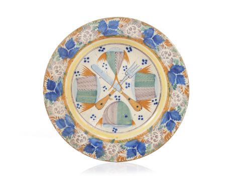 A Portuguese faience dish "Cutlery and fish fillets"Portuguese faienceAttributable to BandeiraPolychrome decoration depicting