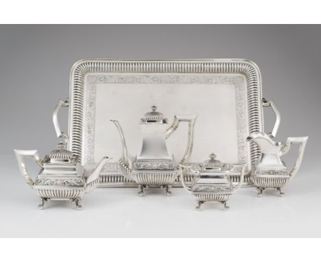 A tea and coffee serviceComprising: teapot, coffee pot, milk jug, sugar bowl and traySilver, fineness .833Polished decoration